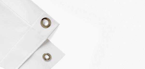 A white sheet with two metal rings on it.