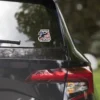 Here's an alt tag for the image: 2A sticker on car window.