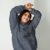 Here's an alt tag for the image: Woman in God, Family, Country hoodie.