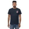 Man in navy tee with small US flag.