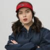 Woman wearing "America First" visor.