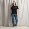 Woman in black Montana t-shirt and jeans.
